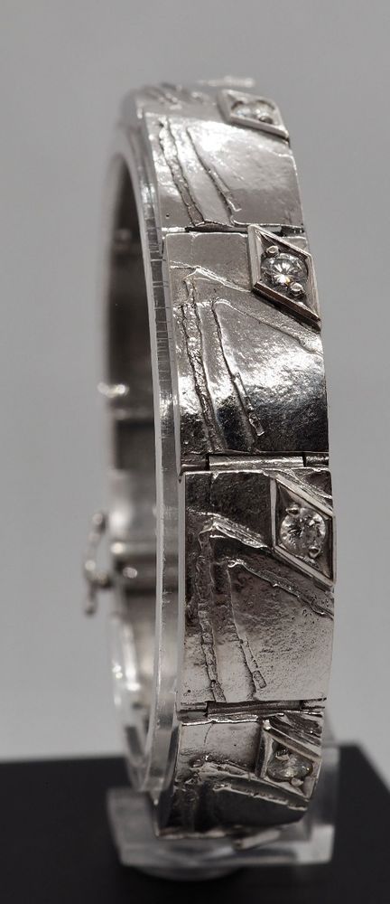 Armbånd i 14 K hvitt gull med 10 diamanter