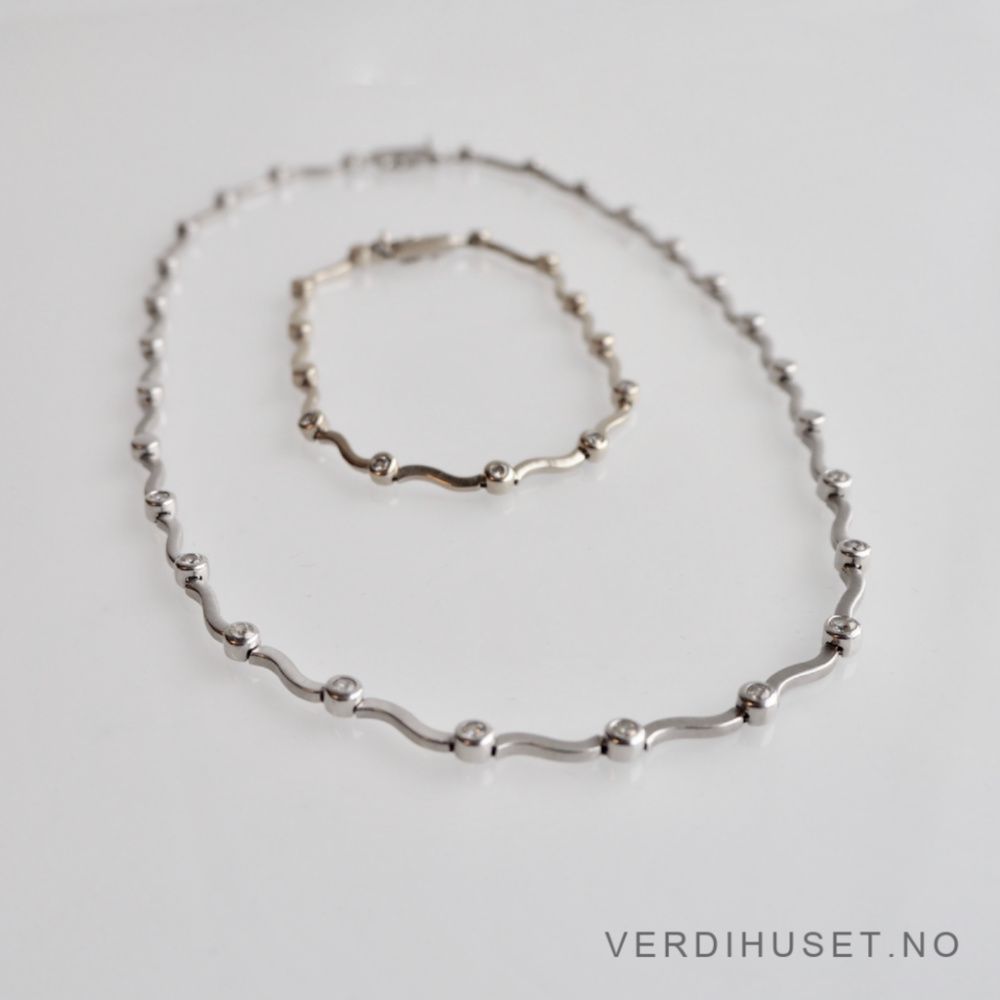 Armbånd i 14 K hvitt gull med blanke stener