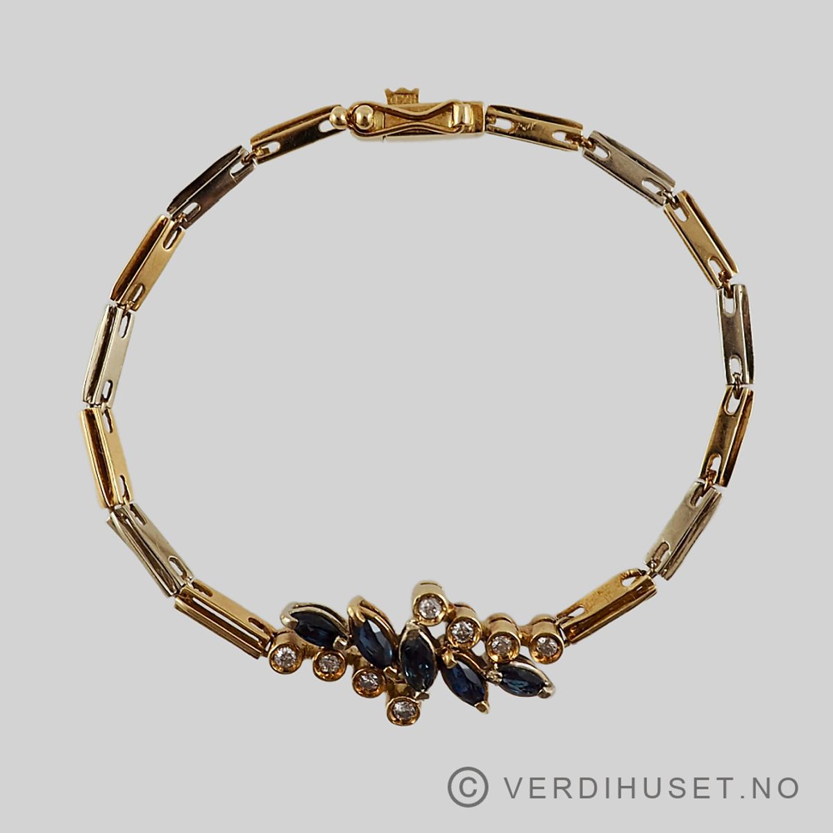 Armbånd i 18 K gull med blå og blanke stener