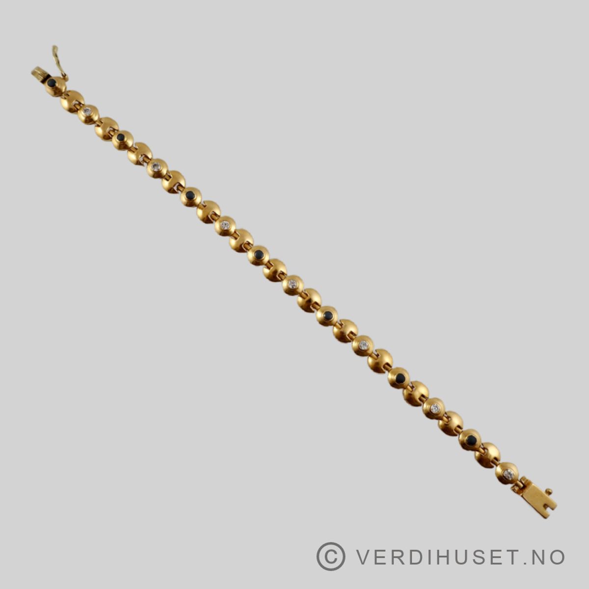 Armbånd i 22 K gull med grå og blanke stener