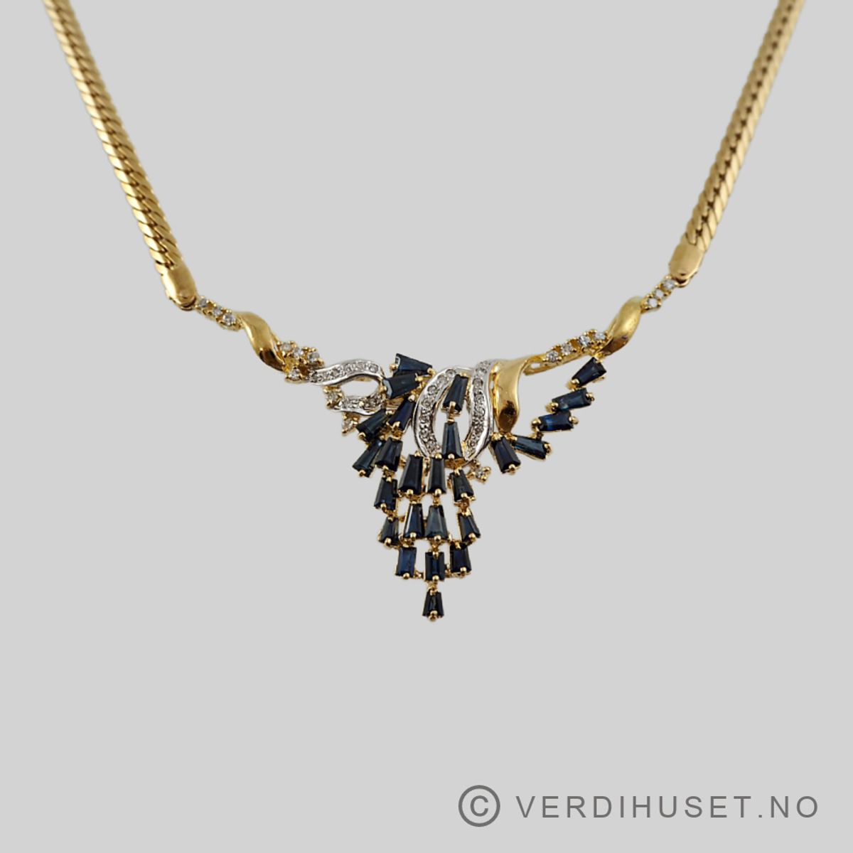 Halssmykke i 18 K gull med blå og blanke stener